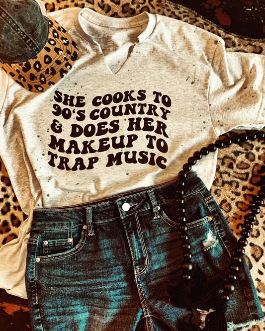 She cooks to 90’s Country & Does Her Makeup to Trap Music $10 Dollar Tee